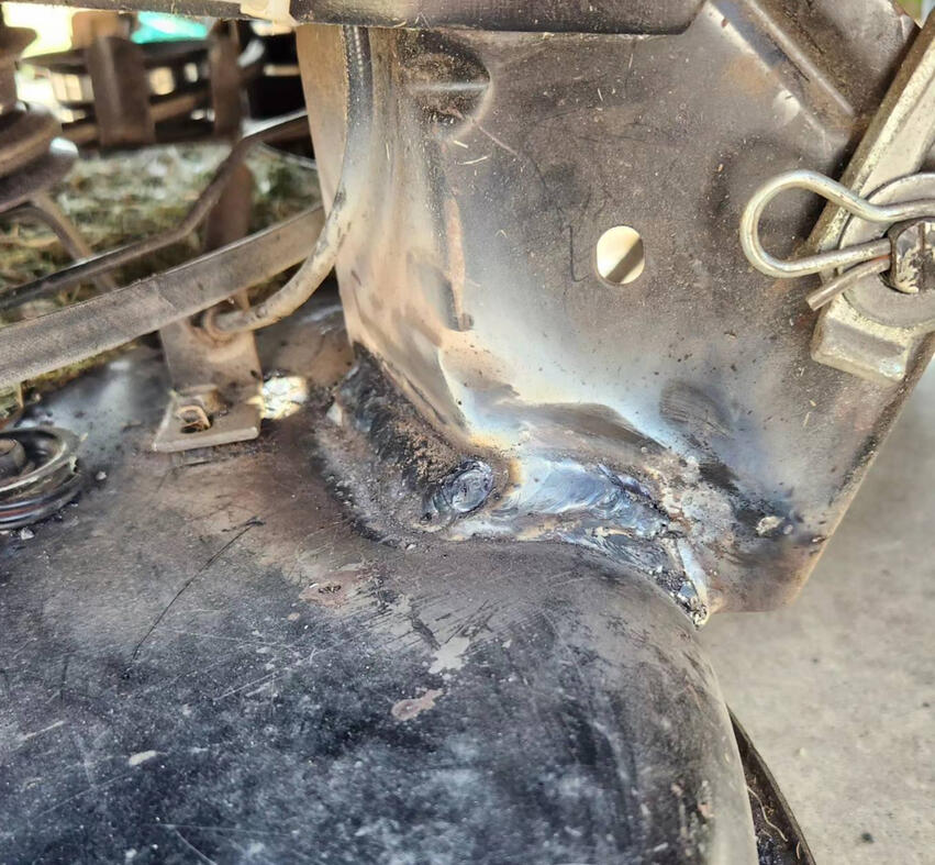 a black weld on a pipe fence