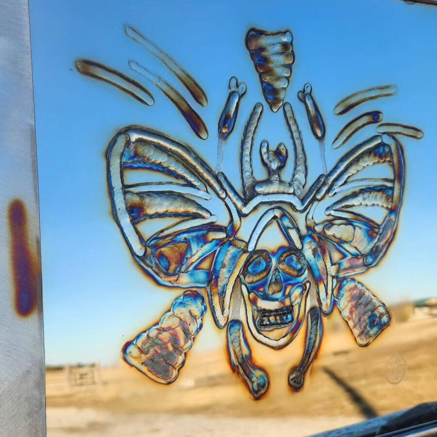 A black welding truck with tool box opened